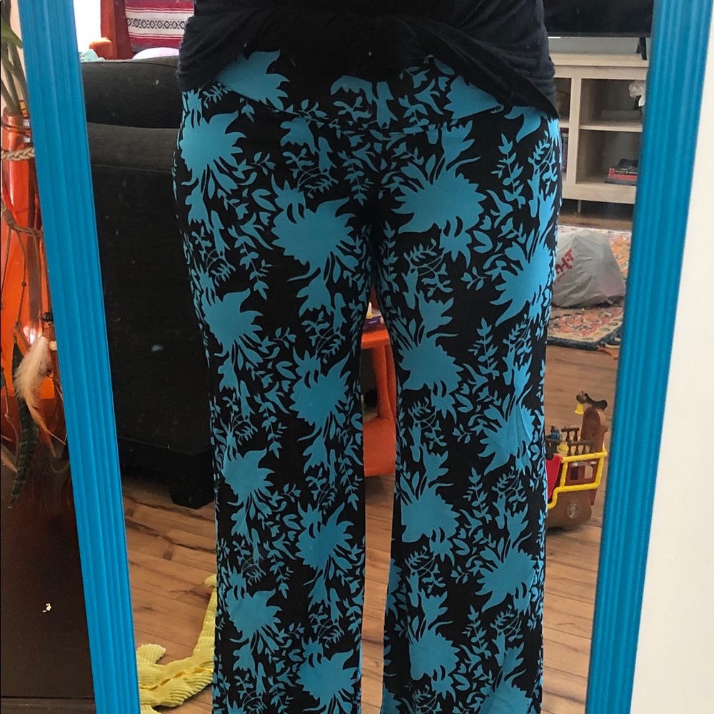 Woman’s bright blue and black patterned pants.